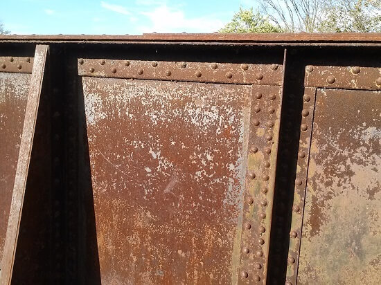 Figure 1. Uniform corrosion on a rusty steel railroad bridge.