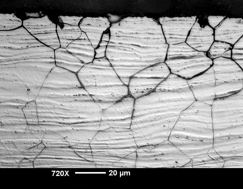 Intergranular corrosion attack in austenitic cold rolled stainless steel sheet.