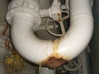Corrosion of a condenser water bypass.