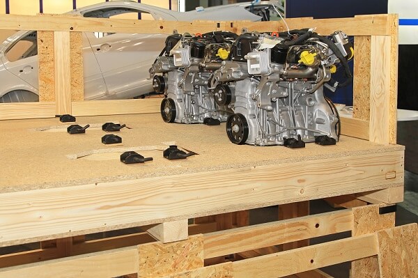 Figure 1. Automotive engine parts being crated for transport.