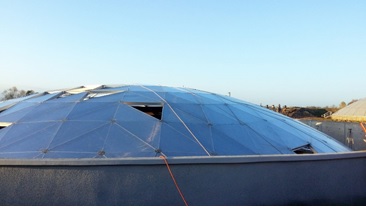 Figure 2. Storage tank with panels removed from geodesic dome roof.