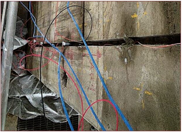 Installing cathodic protection in concrete bridge during repairs.