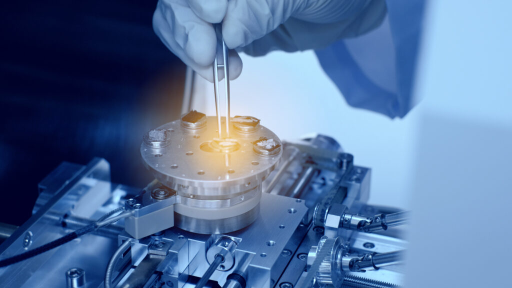 A scientist preparing nanomaterials for scanning in a laboratory.